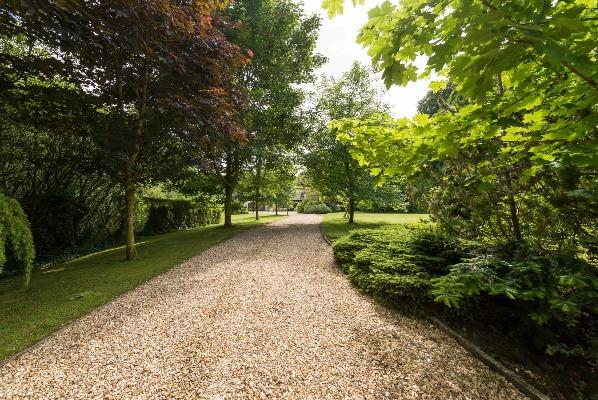 GARDENS Beautifully maintained and mature gardens surround the property which are laid out in lawn and provide