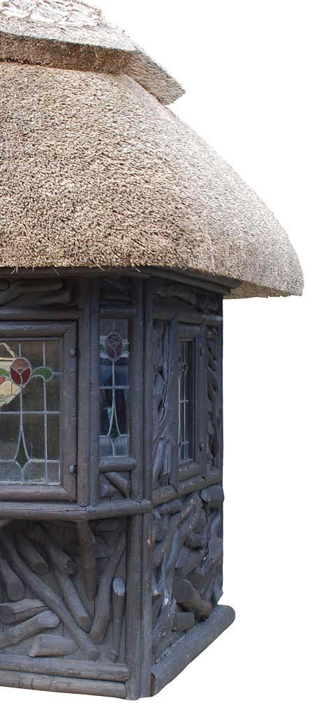 A thatched wooden summer house, circa 1910, by John Julius Caesar, made in Knutsford, Cheshire.