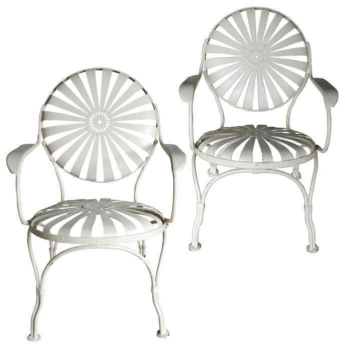 A pair of early 20th century steel-sprung garden armchairs after designs by