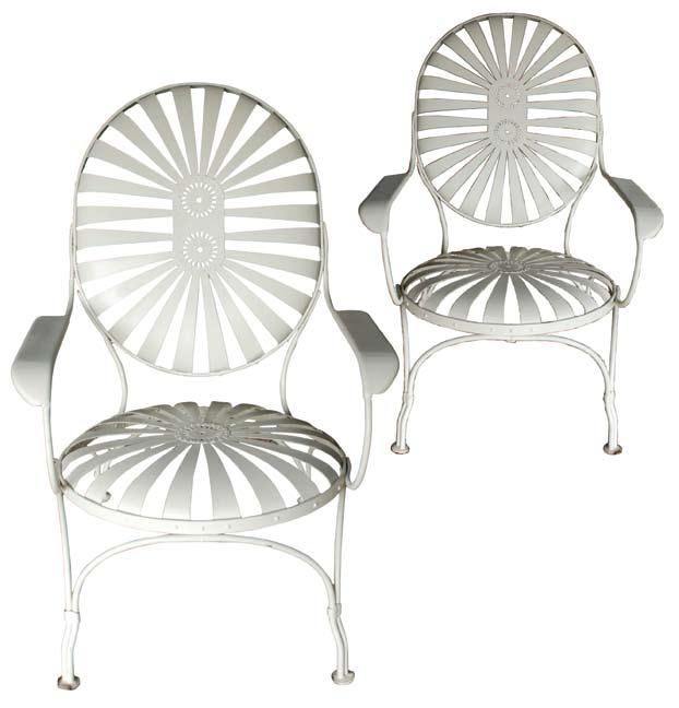 A pair of early 20th century steel-sprung boulevard chairs after designs by