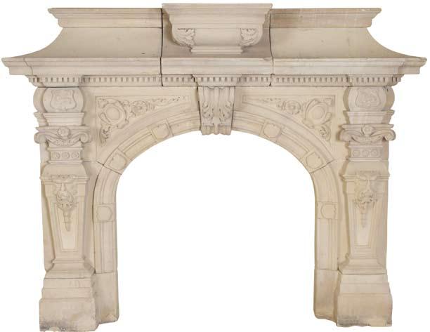 An impressive fireplace in natural limestone, circa 1860. The arched aperture having ornately carved central corbel flanked by elaborate spondrels.