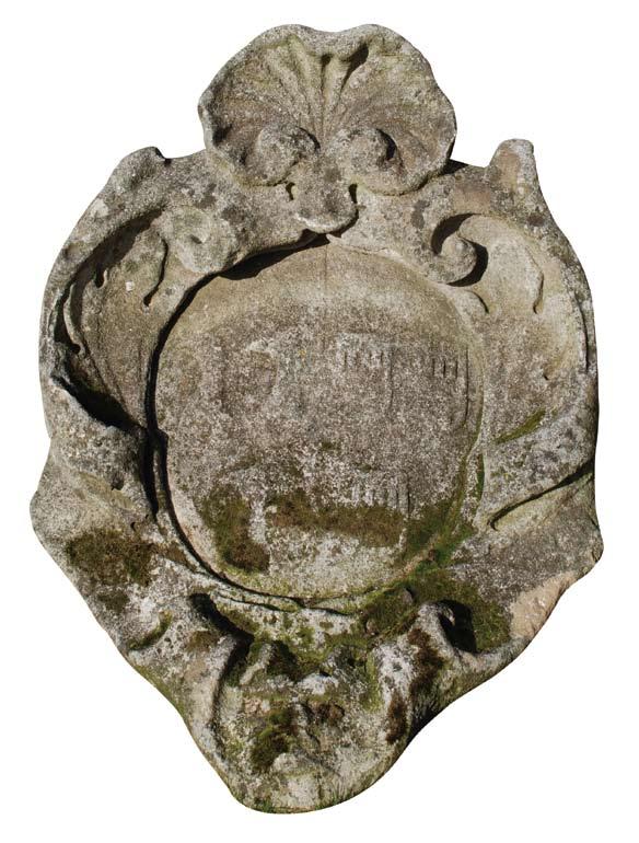 An 18th century granite cartouche of large proportions, circa 1750, having an armorial device incorporating three keys and