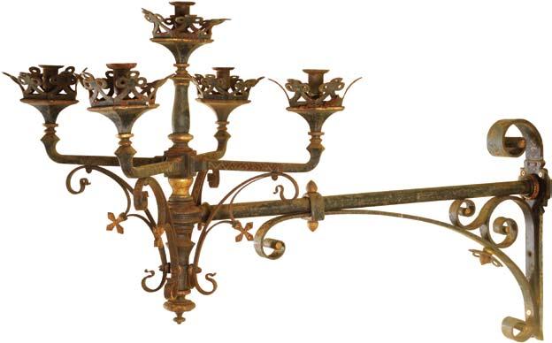 A neo-gothic, French, wrought iron and parcel gilt wall light, attributed to Frédérick Schertzer (1845 1929), with scrolling support and