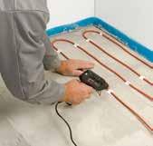 Apply a layer of adhesive primer. Attach the cable (eg. use glue gun) on the floor. Carefully apply an even layer of filler on top of the cable.