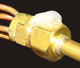 Check all brazed and screwon line connections by applying a soap solution to the joint. A leak will produce bubbles in the soap solution.