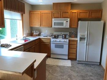 1. Kitchen Room Kitchen Walls and ceilings appear in good condition overall. Flooring is laminate. Heat register present. Accessible outlets operate. Light fixture operates.