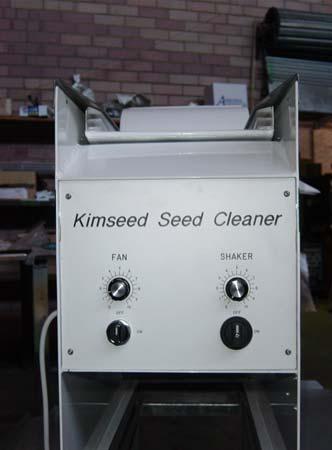 Pour seed sample in feed hopper with gate closed.