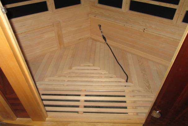 the sauna room. (see Figure 16) 2. Locate the (2) square wood frames that have two cutouts on one side and a vertical slot on the other side.