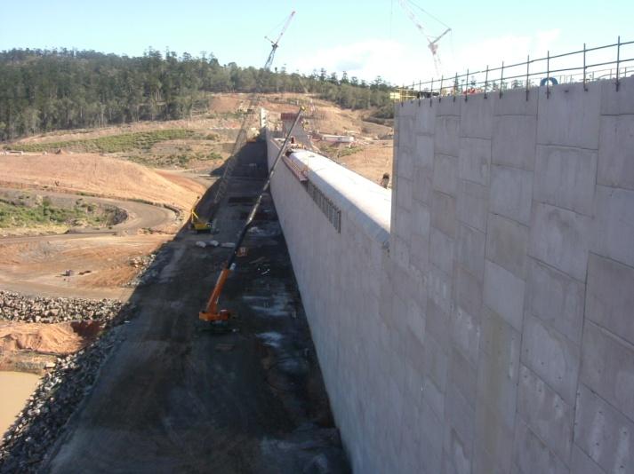 Where the panels meet the plinth a strip of geomembrane was attached to the downstream face of the panel footing and welded to a longitudinal waterstop cast into the grout cap (Figure 5). Figure 5.