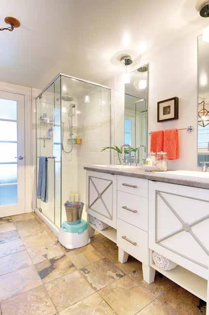 A soaker tub and a large storage unit fit nicely in the large space. (4) There s more storage in the grey-on-white vanity with double sinks.