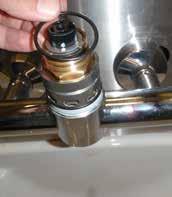 Remove the M5 grub screw located on the back surface of the Swivel spout and lift spout up, off mixer