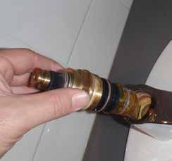 Using a spanner or deep socket on the brass headwork, turn the cartridge in the counter clockwise fashion until it reached the end of its threads and then pull it out of the mixer body -