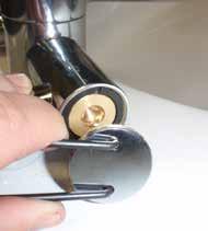 Once the locking pin is removed, carefully lift the handle straight up out of position off the cartridge spline. SEE IMAGE 18 and 19 on page 12. 3.