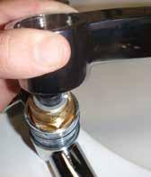 The swivel spout can then be removed by pulling off vertically, however rotating the spout may assist in this process. SEE IMAGE 67 5.