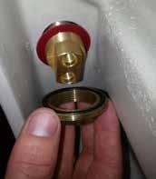 From the underside of the basin/sink, place lower O-ring seal over Basin Mount threaded end and then carefully thread on Hob fixing nut.