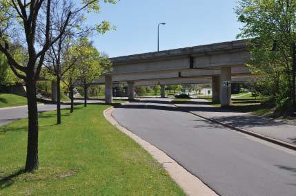 Robbinsdale gateway features in center median at left and at right.