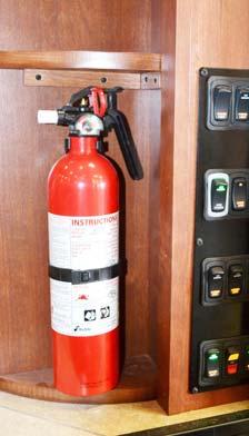SECTION 2 SAFETY AND PRECAUTIONS FIRE EXTINGUISHER A dry chemical Fire Extinguisher is located near the entrance door.