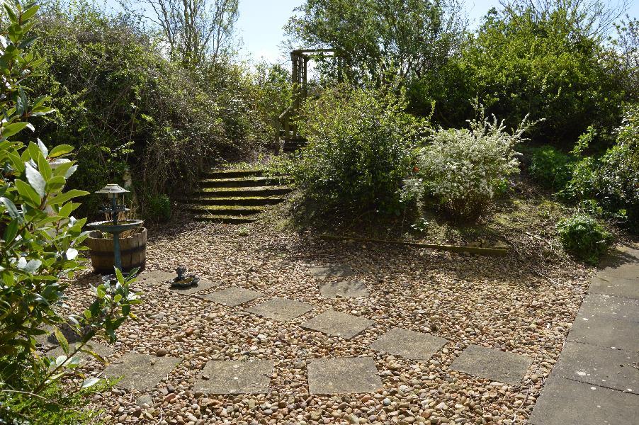 Garden and Grounds Stocken House is approached over a gravelled drive to ample off road parking to the front of the house with access to the garage and forecourt to the front door.
