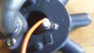 Remove the igniter by removing the screw that holds the igniter to the burner head with a Phillips head screwdriver (picture 4). 6.