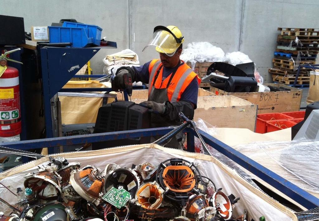 Televisions being dismantled At an onshore e-waste