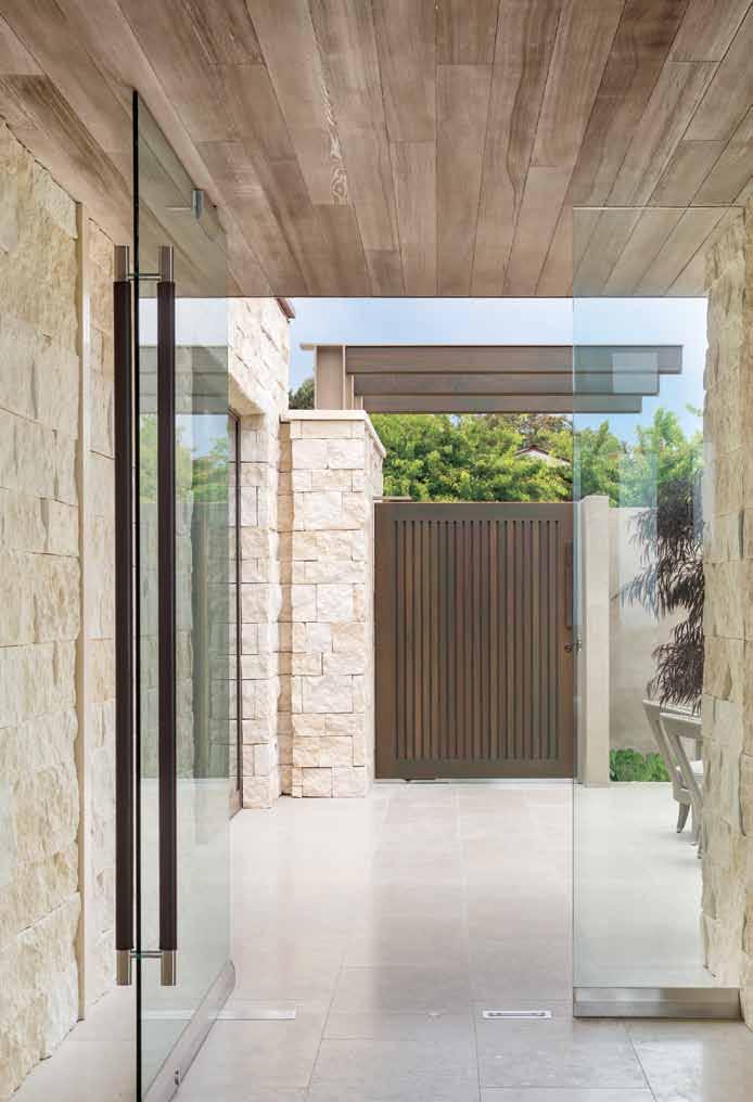 Inspired by the palette of local beaches, architect Carlton Graham worked with textured white oak and limestone to define the contemporary forms of an Orange County house.