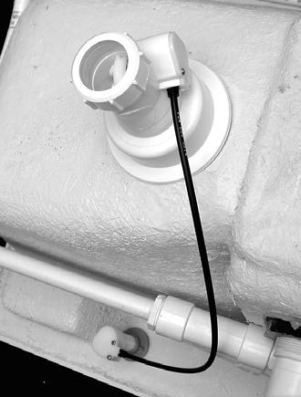 9. Reach under the sink and place the threaded end of the torque tube up through the hole in the sink.