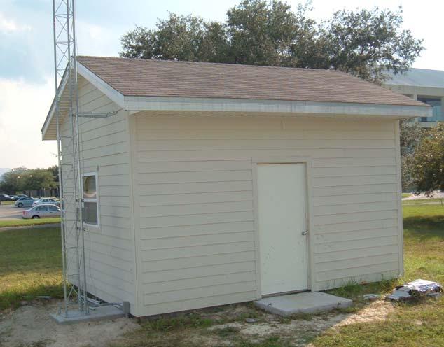 Figure 4. Control test building with conventional asphalt shingle roof covering a ventilated attic.