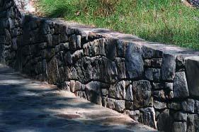 5. Walls shall either be constructed with or have a decorative façade of granite block, stone, or brick.