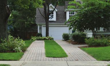 Residential Neighborhoods Garages and Driveways Garages should be properly sited as to not to be a primary design feature of a two-unit dwelling, townhouse, rowhouse, or multi-family residential