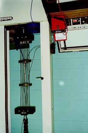 Figure 9 View of the instrumented geogrid specimen in the extension test 1 Strain Gauge Readings (%) 8 6