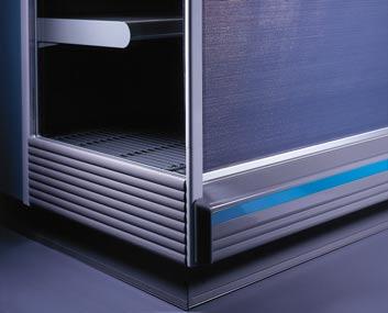 Minimization of the gap between blinds and capturing of the blind in a recess at the bottom shuts the refrigerated space up tight. Integrated Zero Celsius showcase for critical-temperature items.