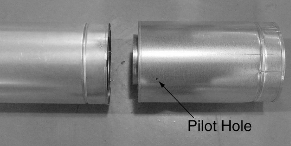 screws through the overlapping portions of the outer flues using the pilot holes (see Figure 5).