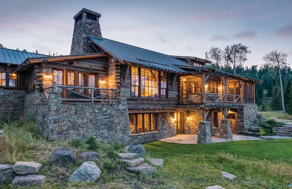 boasts dramatic mountain views. The guest barn entry features whitewashed walls, reclaimed oak flooring and custom interior doors.