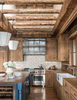 When they first came to me, they wanted a round-log home, recalls Miller, but ultimately they chose a combination: hewn for the majority of interior and exterior walls, and round logs for rafters,