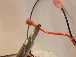 4 Cut spade terminal off bottom wire from old thermostat (blue or
