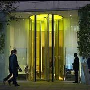 Bespoke 5500mm high, 3-wing automatic Circular Prestige revolving door with a coloured, back-lit ceiling