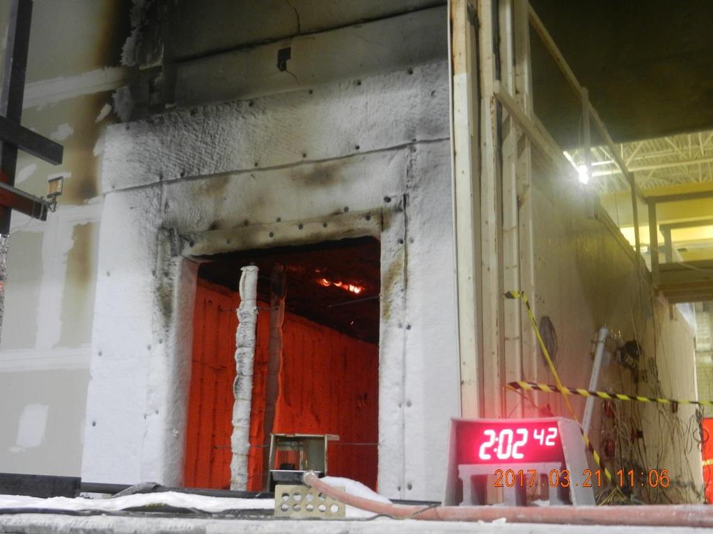 NFPA FPRF COMPARTMENT TESTS Fire re-growth observed in