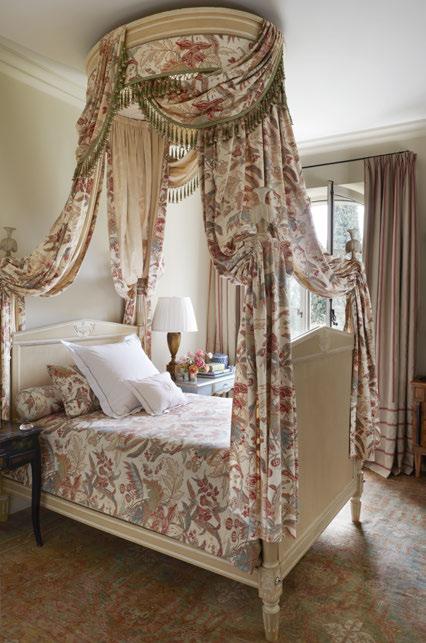 To that end, she upholstered the walls of the master bedroom in a fabric resembling French ticking while kicking it up a notch with an artful mix of bold Pierre Frey prints and an 18th-century gilt