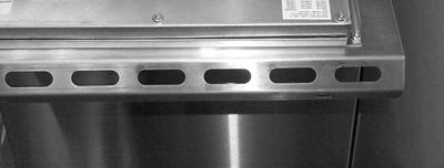 Remove the two screws from the upper corners of the control panel on fryers that have 90º angle topcaps.