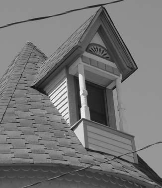 Changing the original roof shape, line, pitch, overhangs and materials, including character-defining elements such as chimneys, dormers, cupolas, turrets, cresting and weathervanes, is not