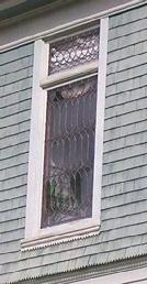 Group of three 1-over-1 windows in shingled