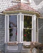 Pediments are common on half-hipped and shed roofs. The porch may be a simple, unadorned cover, but usually the porch is one of the more ornamented parts of the dwelling.