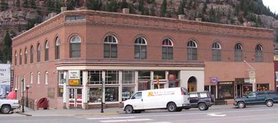 The buildings are one or two story and flat-roofed, and are of four types: single storefront (width of twenty-five feet with a single entrance); double storefront (width of fifty feet or more and two