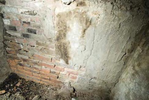 Perhaps the blocks were reused from a previous fireplace surround at this location. Fireplace Masonry - C. 1921 rebuilding of c. 1820s fireplace The current exposed masonry is a c.
