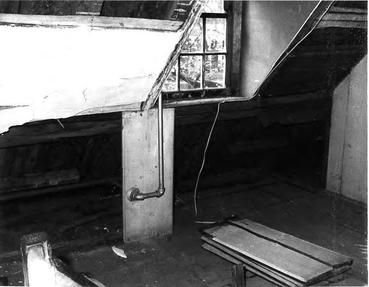 The Buckman Tavern HISTORIC STRUCTURE REPORT Figure 44. North wall of the southeast attic chamber with finish materials beginning to be removed to investigate infestation of the timbers. S. Lawrence Whipple, Photographer, 1973.