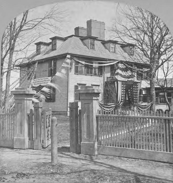 View of the Buckman Tavern decorated for the centennial celebration in 1875.