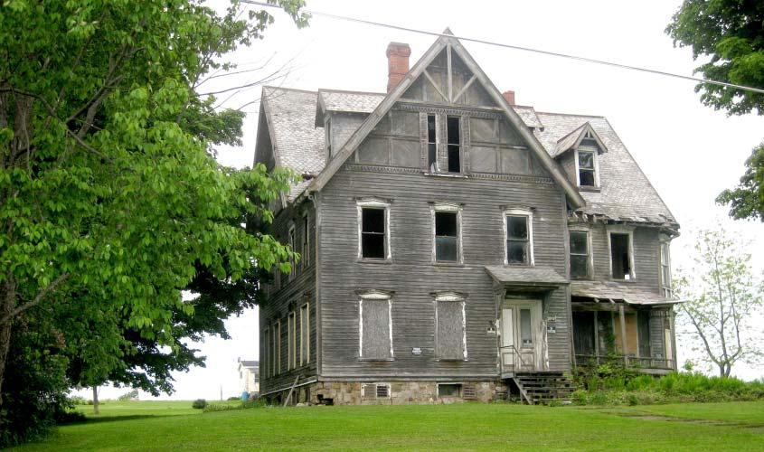 of Cayuga Lake. A large old house in the Queen Anne and Shingle-style (c.