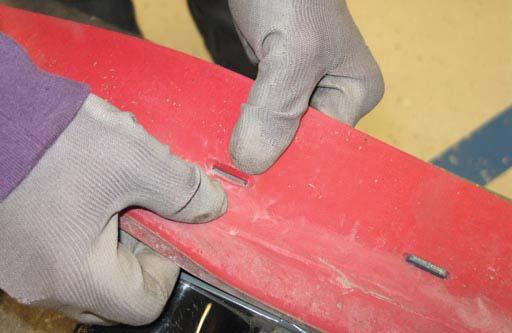 Place the rotated or new squeegee blade onto the rear squeegee assembly.