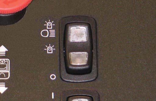 Turn the key switch to the OFF position, then turn the key fully clockwise and release it to the ON position. NOTE: An audible alarm will sound when the directional switch is placed into reverse.