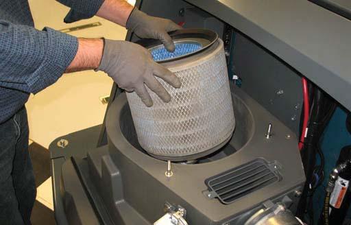 removing the fi lter from the machine. Inspect and clean the fi lter after every 100 hours of operation.
